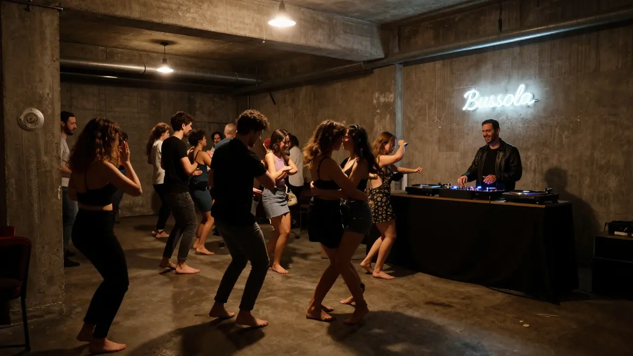 Dancers moving on a concrete floor in a warehouse club with exposed pipes and vinyl records spinning.